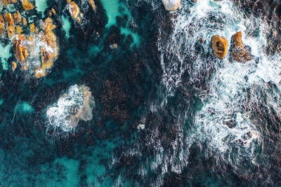 Sea waves splashing on rocks