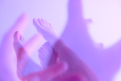 Close-up of hands over blue background