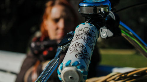 Close-up of woman with bicycle