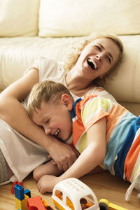 High angle view of woman lying on bed at home