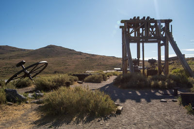 Lifeguard hut on field against clear sky