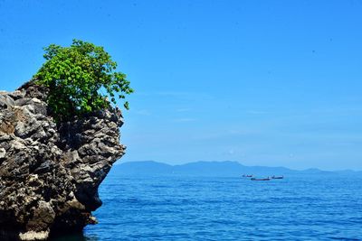 Scenic view of sea against clear blue sky