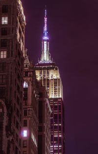 Illuminated buildings in city at night