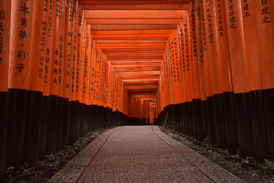 Empty road leading towards temple outside building