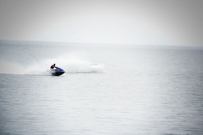 Man in boat on sea