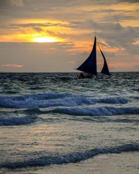 Scenic view of sea against cloudy sky