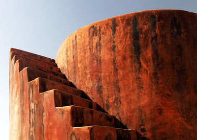 Low angle view of steps against clear sky at jaigarh fort on sunny day