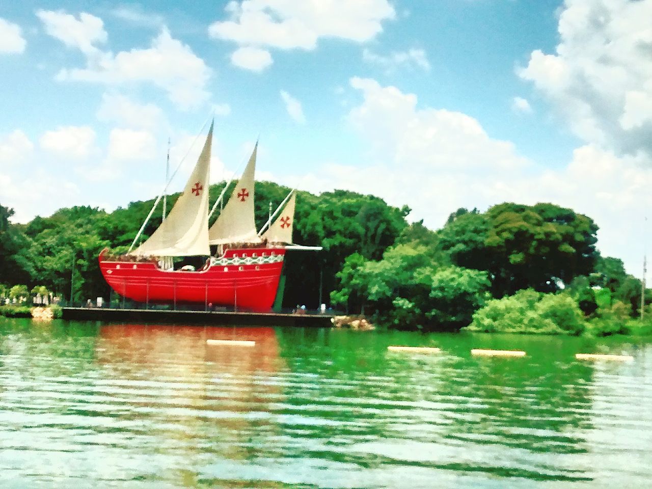 water, nautical vessel, waterfront, boat, transportation, tree, mode of transport, sky, moored, cloud - sky, river, lake, built structure, rippled, nature, cloud, travel, day, tranquility, outdoors