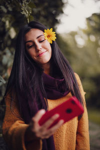 Young woman using mobile phone