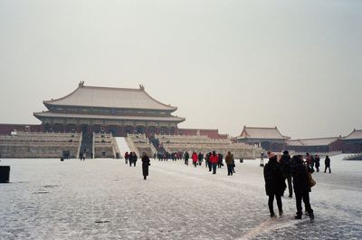 Group of people in front of historical building