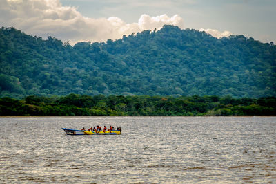 Scenic view of river against mountains