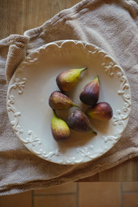 High angle view of fruits in plate on table