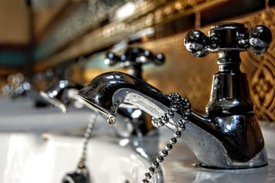 Close-up of faucet in bathroom