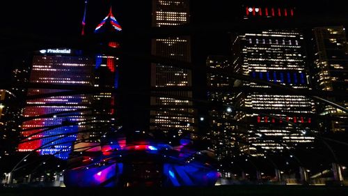 Illuminated buildings in city at night