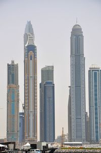 Skyscrapers in city against clear sky