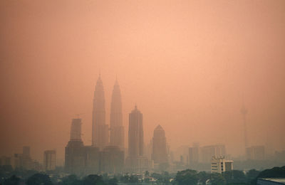 Buildings in city against sky