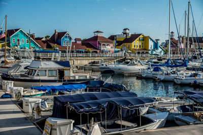 Boats moored at harbor