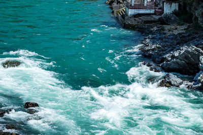 High angle view of sea by rocks