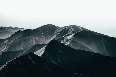 Scenic view of snowcapped mountains against clear sky