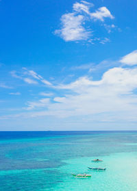 Scenic view of sea against blue sky