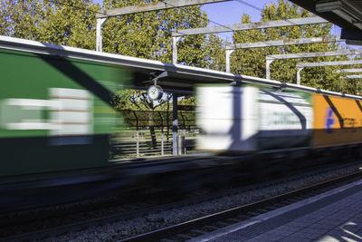 Blurred motion of train at railroad station