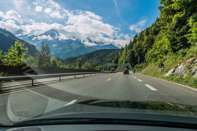 Road seen through car windshield