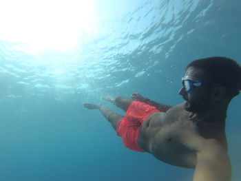 Man swimming in sea