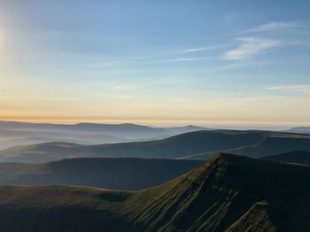 Scenic view of mountains against sky during sunset