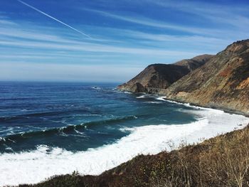 Scenic view of sea against blue sky