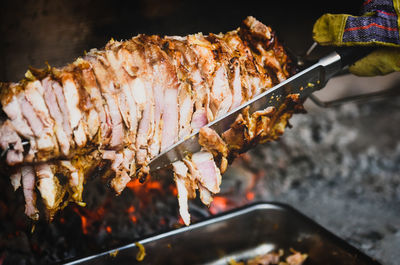 High angle view of meat on barbecue grill