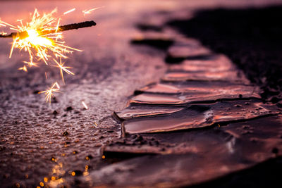 Close-up of fire in water at night