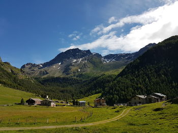 Scenic view of landscape and mountains against sky