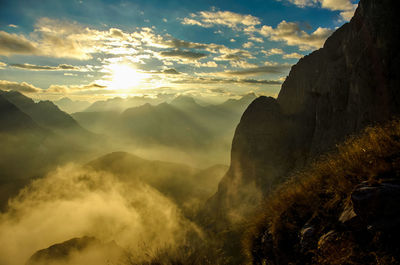 Scenic view of mountains against sky at sunset