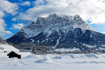 Scenic view of snowcapped mountains against sky