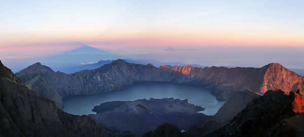 Volcanic crater against sky during sunset