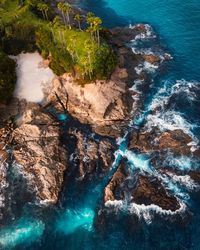 High angle view of rocks on sea