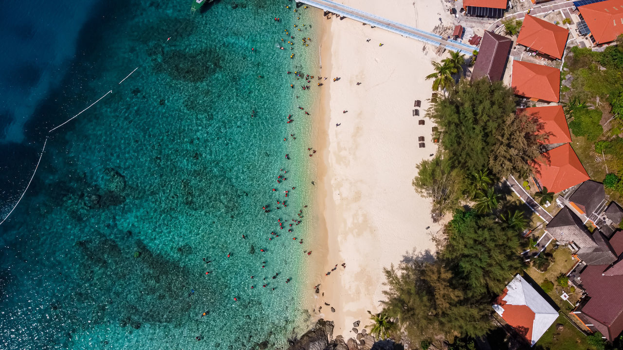 HIGH ANGLE VIEW OF SWIMMING POOL BY SEA