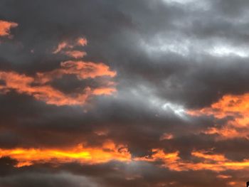 Low angle view of dramatic sky during sunset