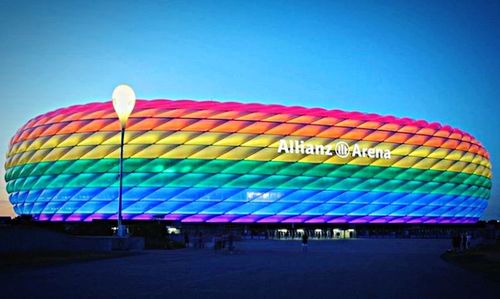 Multi colored lights against clear blue sky