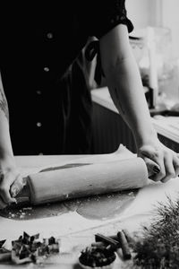 Close-up of woman preparing food at table