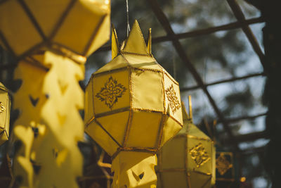 Low angle view of illuminated lanterns hanging on ceiling