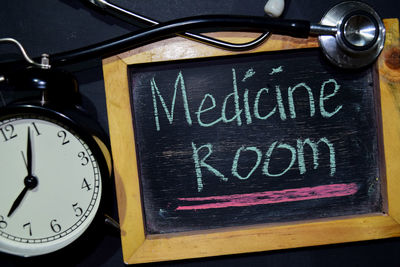 Close-up of clock on table