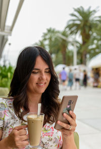 Young woman using mobile phone