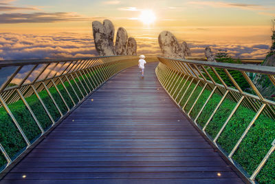 People walking on footbridge