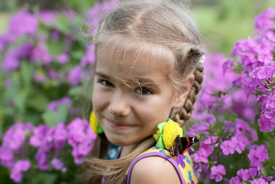 Close-up portrait of smiling young woman