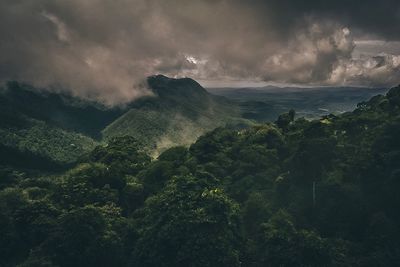 Scenic view of landscape against dramatic sky