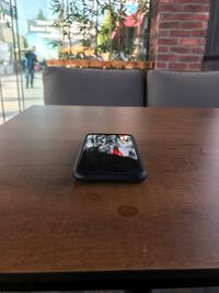Close-up of smart phone on table