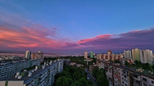 High angle view of buildings against sky during sunset