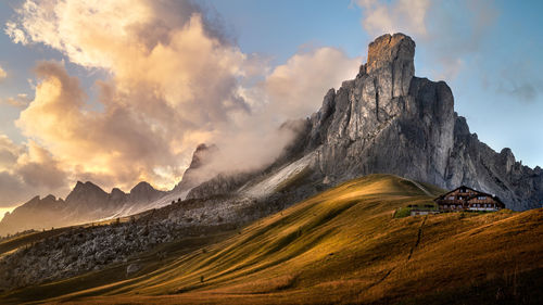 Panoramic view of land and mountains against sky