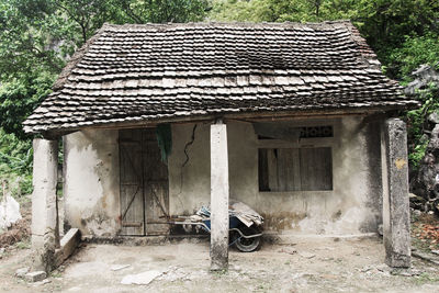 Abandoned house against trees